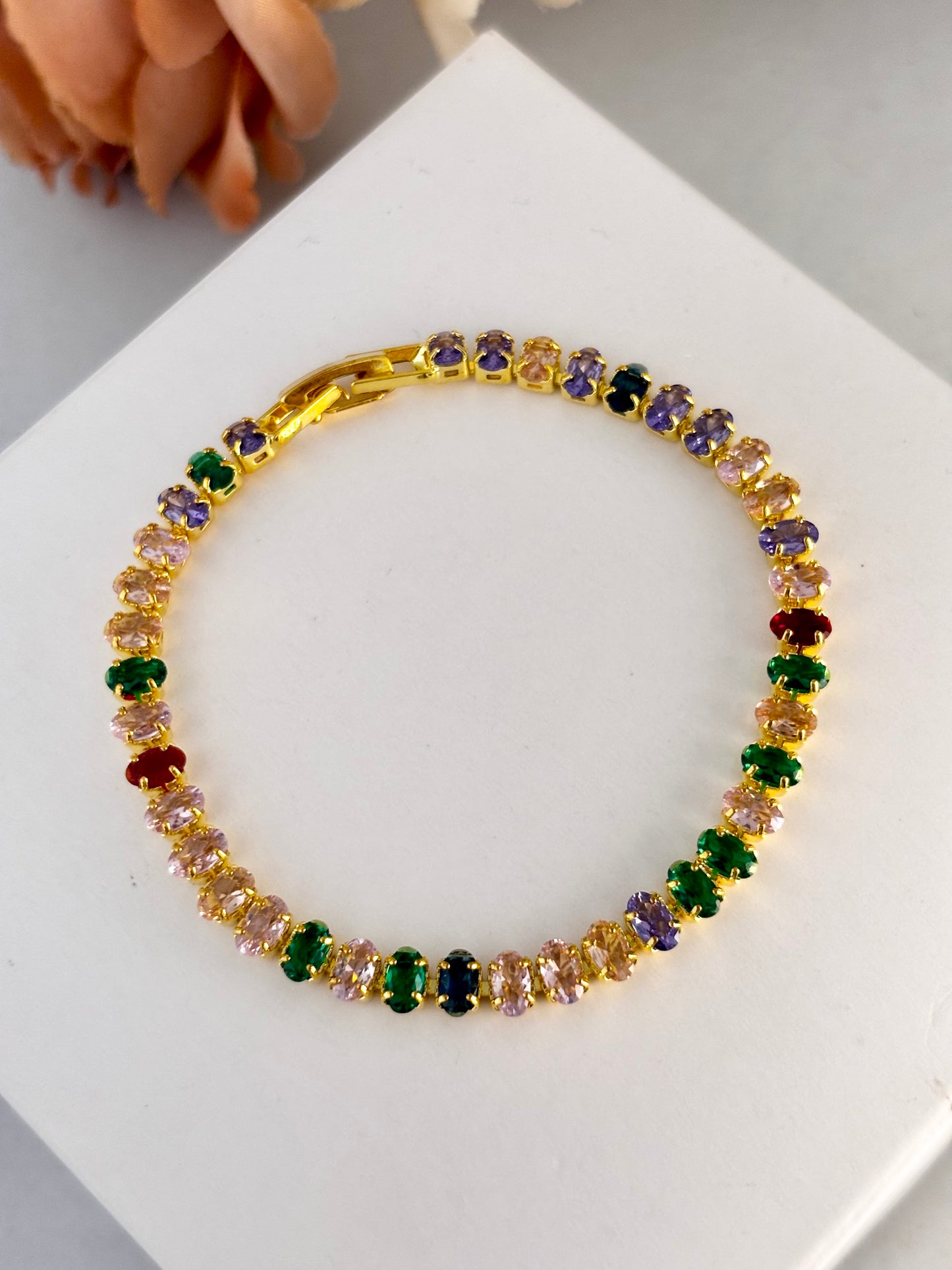 Multicolored gemstone bracelet on a white surface