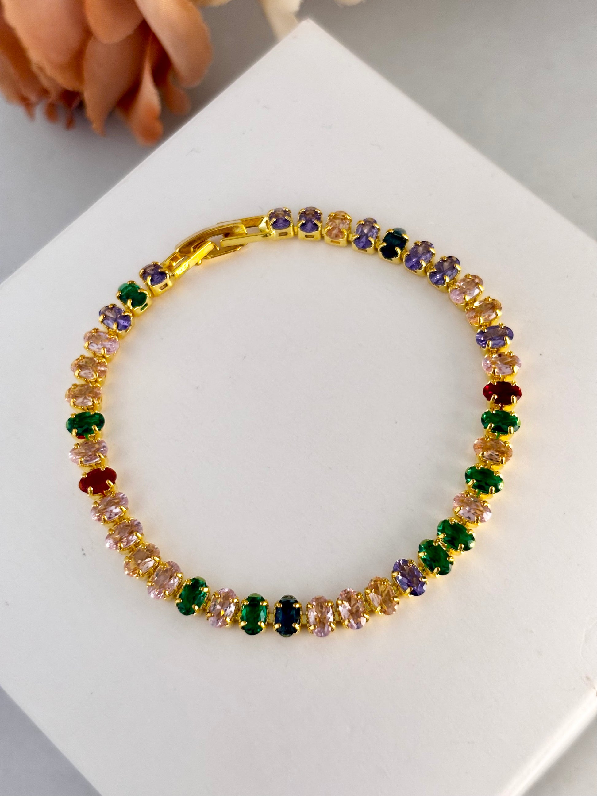 Multicolored gemstone bracelet on a white surface